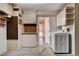 Functional laundry room with ample storage cabinets, washer, and dryer hookups at 9337 Quail Ridge Dr, Las Vegas, NV 89134
