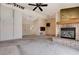 Cozy living room with a brick fireplace, providing warmth and charm at 9337 Quail Ridge Dr, Las Vegas, NV 89134