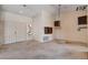 Open living room with a stained glass window and unique lighting fixtures at 9337 Quail Ridge Dr, Las Vegas, NV 89134