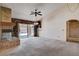 Living room featuring a brick fireplace and sliding doors to the outdoor area at 9337 Quail Ridge Dr, Las Vegas, NV 89134