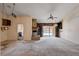 Spacious living room featuring a fireplace, open floor plan, and access to the kitchen at 9337 Quail Ridge Dr, Las Vegas, NV 89134