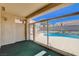 Enclosed patio offering views of the backyard pool and landscaping through large glass windows at 9337 Quail Ridge Dr, Las Vegas, NV 89134