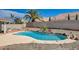 Backyard view of private pool with desert landscaping and privacy wall at 9337 Quail Ridge Dr, Las Vegas, NV 89134