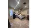 Cozy bedroom with tiled floors, a ceiling fan, and natural light at 9816 Villa Ridge Dr, Las Vegas, NV 89134