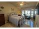 Bedroom featuring tiled floors, bay window, and space for a home spa at 9816 Villa Ridge Dr, Las Vegas, NV 89134