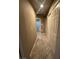 Hallway with tile floors, storage closets, and access to the bathroom at 9816 Villa Ridge Dr, Las Vegas, NV 89134