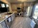 Modern kitchen features stainless steel appliances, granite countertops, and ample cabinet space at 9816 Villa Ridge Dr, Las Vegas, NV 89134