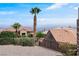 Beautiful tile roof, desert landscaping, and an elegant design enhance the property's curb appeal at 11009 Summers End Ave, Las Vegas, NV 89134
