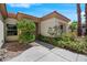 Inviting front entrance with lush landscaping and a well-manicured walkway at 11009 Summers End Ave, Las Vegas, NV 89134