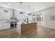 Bright, modern kitchen with white cabinetry, sleek countertops, and stainless-steel appliances at 11009 Summers End Ave, Las Vegas, NV 89134