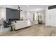 Open living space with ceiling fan, modern fireplace and stylish finishes at 11009 Summers End Ave, Las Vegas, NV 89134