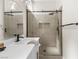Modern bathroom showing a double vanity and a glass shower enclosure with a built-in niche at 11009 Summers End Ave, Las Vegas, NV 89134
