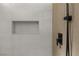 Close-up of a modern shower with neutral tile and a convenient built-in niche at 11009 Summers End Ave, Las Vegas, NV 89134