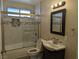 Bathroom with updated fixtures, shower-tub combo, and modern vanity at 1220 Toledo St, Henderson, NV 89015