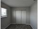 Bedroom features wood-look floors, closet, and window offering natural light at 1220 Toledo St, Henderson, NV 89015
