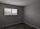 Bright bedroom with wood-look flooring and natural light from window at 1220 Toledo St, Henderson, NV 89015