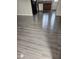 Kitchen featuring modern appliances and wood-look flooring at 1220 Toledo St, Henderson, NV 89015