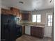 Well-lit kitchen featuring wood cabinets, stainless steel appliances, and a practical layout at 1220 Toledo St, Henderson, NV 89015