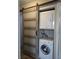 Stacked washer and dryer closet with a sliding door for convenience at 1220 Toledo St, Henderson, NV 89015