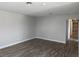 Living room featuring wood-look floors, bright light and ample space at 1220 Toledo St, Henderson, NV 89015