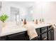 Bright bathroom features a double sink vanity with modern faucets at 12426 Mosticone Way, Las Vegas, NV 89141