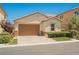 Charming single-story home featuring a two-car garage and a well-manicured front lawn at 12426 Mosticone Way, Las Vegas, NV 89141