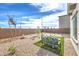 Private backyard with low-maintenance desert landscaping and a cozy seating area at 1289 Miller Springs Ln # 96, North Las Vegas, NV 89084