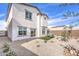 Spacious backyard featuring desert landscaping and a covered patio at 1289 Miller Springs Ln # 96, North Las Vegas, NV 89084