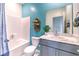 Well-lit bathroom featuring a tub, toilet, vanity, mirror, and modern decor at 1289 Miller Springs Ln # 96, North Las Vegas, NV 89084