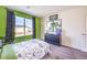 Inviting bedroom with lively green accents, providing a fun and relaxing environment at 1289 Miller Springs Ln # 96, North Las Vegas, NV 89084