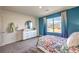 Serene bedroom featuring a window with picturesque views, complemented by soft furnishings at 1289 Miller Springs Ln # 96, North Las Vegas, NV 89084