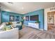 Bonus room with carpet, sectional sofa, and an accent wall with a TV at 1289 Miller Springs Ln # 96, North Las Vegas, NV 89084