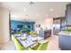 Bright kitchen with gray cabinets, stainless appliances, a marble dining table, and an island at 1289 Miller Springs Ln # 96, North Las Vegas, NV 89084