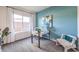 Bright office with natural light, a modern white desk, and neutral blue walls at 1289 Miller Springs Ln # 96, North Las Vegas, NV 89084
