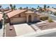 A charming single-story house with a well-manicured front yard and a driveway at 1613 Glenrosa Dr, North Las Vegas, NV 89031