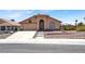 Charming single-story home with a well-manicured front yard and a covered entryway at 1613 Glenrosa Dr, North Las Vegas, NV 89031
