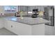Kitchen features modern countertops, stainless steel appliances, and stylish cabinetry at 1613 Glenrosa Dr, North Las Vegas, NV 89031