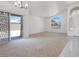 Open living space with large windows that flood the room with natural light and backyard access at 1613 Glenrosa Dr, North Las Vegas, NV 89031