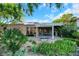 Backyard with covered patio, desert landscaping, and mountain views is perfect for outdoor enjoyment at 1805 Prichard Ave, Henderson, NV 89052