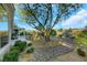 Lush backyard featuring desert landscaping, a rock water feature, and ample space for outdoor activities at 1805 Prichard Ave, Henderson, NV 89052