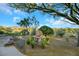 Relaxing backyard with desert landscaping, decorative water feature, and serene mountain views at 1805 Prichard Ave, Henderson, NV 89052