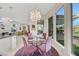 Dining area with designer light fixture, table setting and beautiful windows showing outdoor views at 1805 Prichard Ave, Henderson, NV 89052
