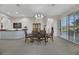 Elegant dining room with a chandelier, large windows with shutters, and comfortable seating for formal occasions at 1805 Prichard Ave, Henderson, NV 89052