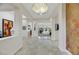 Bright hallway featuring neutral walls, tile floors, recessed lighting, and open floor plan at 1805 Prichard Ave, Henderson, NV 89052