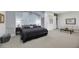 A large main bedroom featuring a colorful accent wall and adjacent sitting room at 1805 Prichard Ave, Henderson, NV 89052