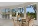 Cozy seating area with large windows, comfortable chairs, and a view of the lush surroundings at 1805 Prichard Ave, Henderson, NV 89052
