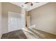 Bedroom features carpet floors, a ceiling fan, base molding, closet and a door to another room at 1904 Hot Oak Ridge St, Las Vegas, NV 89134