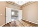 Spacious bedroom with hardwood floors, a ceiling fan, and a doorway into the next room at 1904 Hot Oak Ridge St, Las Vegas, NV 89134