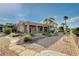 Well-maintained exterior showcasing desert landscaping and a covered patio at 1904 Hot Oak Ridge St, Las Vegas, NV 89134