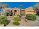 Beautiful home boasting mature landscaping, desert rock, and a quaint walkway leading to the front door at 1904 Hot Oak Ridge St, Las Vegas, NV 89134